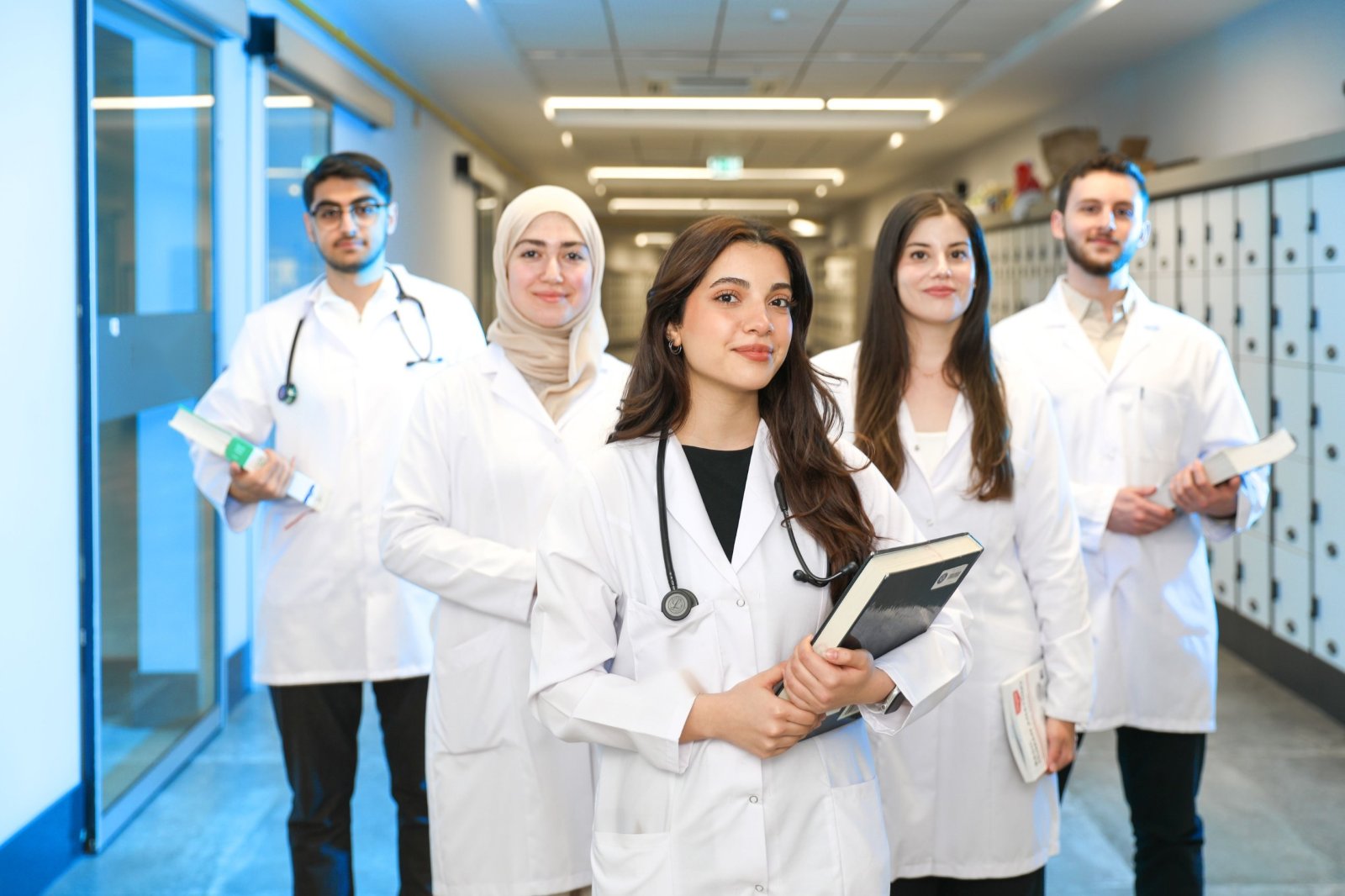 Healthcare professionals in white coats standing together